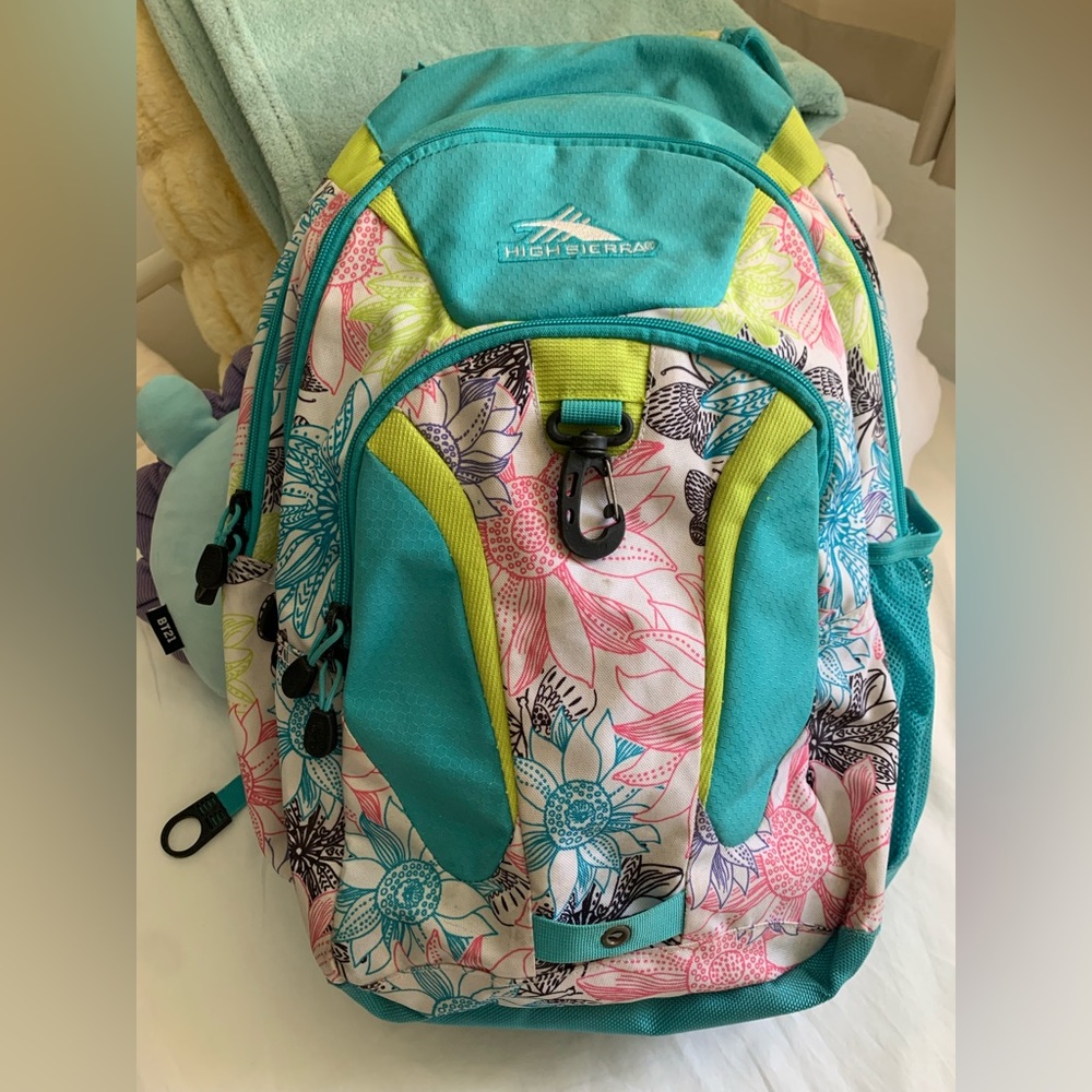 High Sierra white and blue backpack w/ green and pink flower details